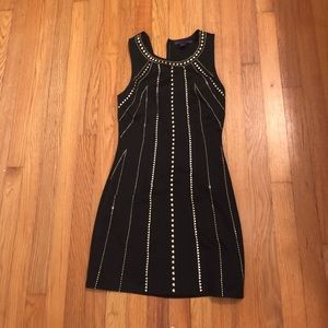 Black skater dress with gold embellishments
